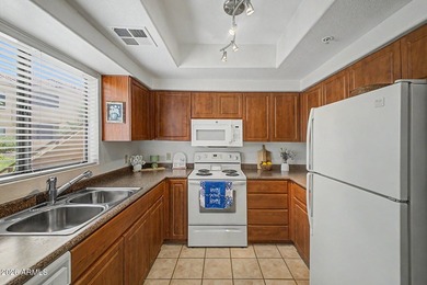 Nestled within the gated Sienna Condominiums in Scottsdale, just - photo 6