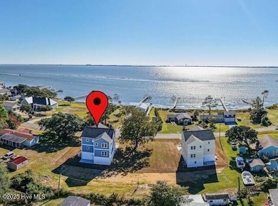 Experience elevated coastal living in this impeccably crafted