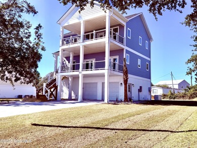 Experience elevated coastal living in this impeccably crafted