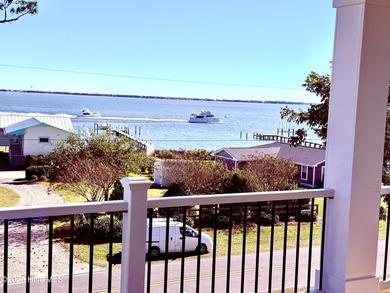 Experience elevated coastal living in this impeccably crafted