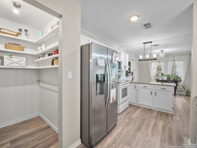 Step into this beautifully remodeled home where high end
