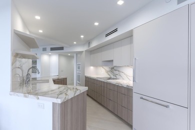 Sleek, modern and luxuriously fully renovated unit. Three - photo 10