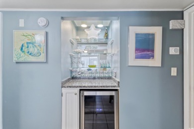 This beautifully updated, rarely available, corner unit, located