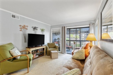 This beautifully updated, rarely available, corner unit, located