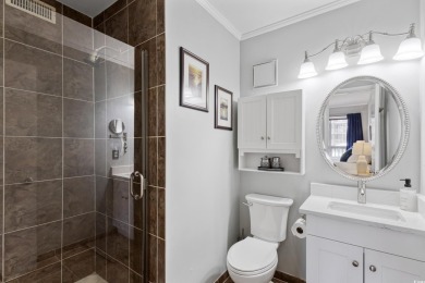 This beautifully updated, rarely available, corner unit, located