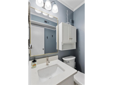 This beautifully updated, rarely available, corner unit, located