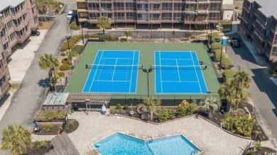 This beautifully updated, rarely available, corner unit, located