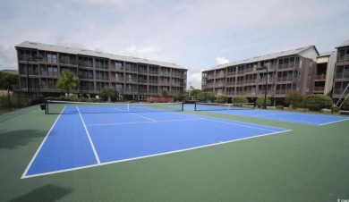 This beautifully updated, rarely available, corner unit, located