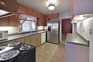 This charming home is loaded with character! Lovely tile front - photo 8
