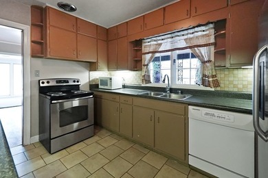 This charming home is loaded with character! Lovely tile front - photo 9