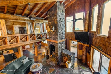 Set on 9.81 private acres with rare dual lake views of Fernan - photo 11