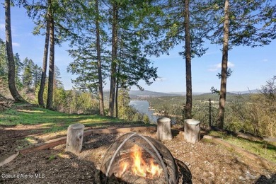 Set on 9.81 private acres with rare dual lake views of Fernan - photo 12