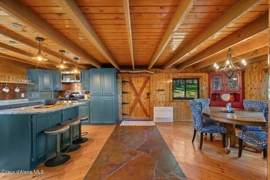 Set on 9.81 private acres with rare dual lake views of Fernan - photo 16