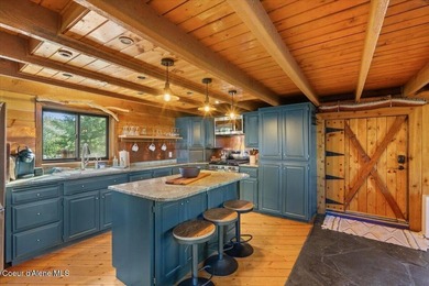 Set on 9.81 private acres with rare dual lake views of Fernan - photo 18