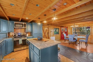 Set on 9.81 private acres with rare dual lake views of Fernan - photo 19