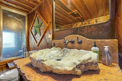 Set on 9.81 private acres with rare dual lake views of Fernan - photo 25