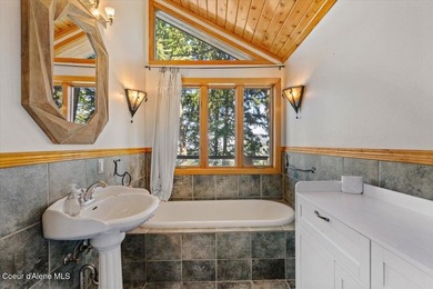 Set on 9.81 private acres with rare dual lake views of Fernan - photo 31