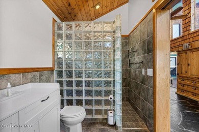 Set on 9.81 private acres with rare dual lake views of Fernan - photo 33