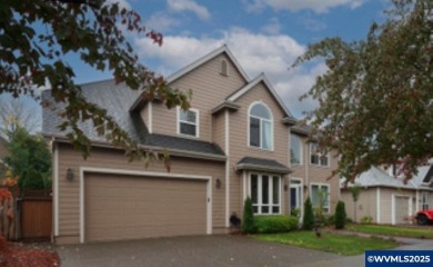 Exquisite home features vaulted ceilings & arched windows