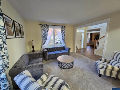 Exquisite home features vaulted ceilings & arched windows