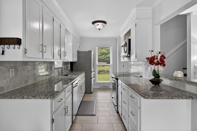 Tucked away on a charming and tranquil cul-de-sac in the coveted - photo 11