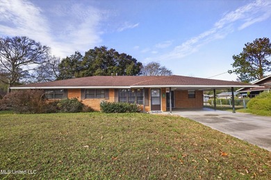 This well-maintained 3-bedroom brick home in Long Beach offers a - photo 1