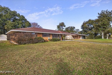 This well-maintained 3-bedroom brick home in Long Beach offers a - photo 4