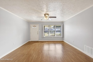 This well-maintained 3-bedroom brick home in Long Beach offers a - photo 6