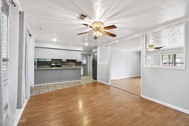 This well-maintained 3-bedroom brick home in Long Beach offers a - photo 9