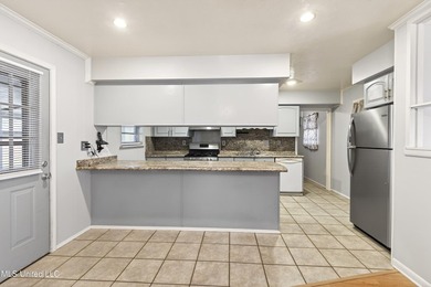 This well-maintained 3-bedroom brick home in Long Beach offers a - photo 10