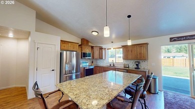 2023-built home set on nearly an acre of level, usable land - photo 16
