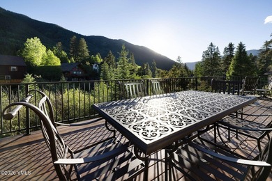 Strategically positioned along the banks of Gore Creek, this - photo 11