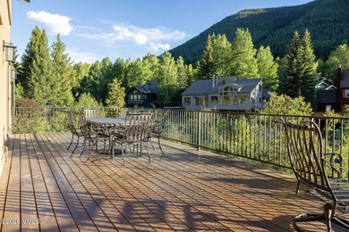 Strategically positioned along the banks of Gore Creek, this - photo 12