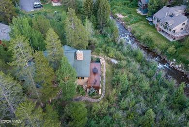 Strategically positioned along the banks of Gore Creek, this - photo 13
