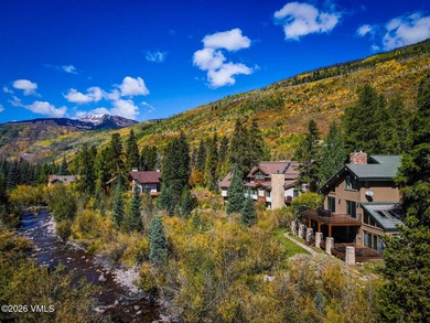 Strategically positioned along the banks of Gore Creek, this - photo 14