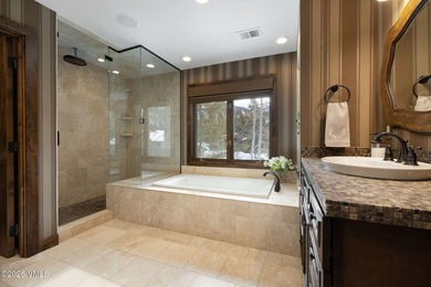 Strategically positioned along the banks of Gore Creek, this - photo 17