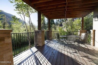 Strategically positioned along the banks of Gore Creek, this - photo 29
