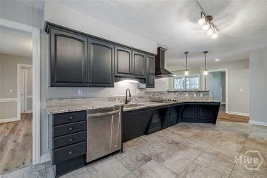 Welcome home to this stunning all-brick retreat featuring an