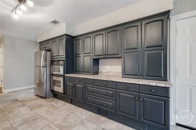 Welcome home to this stunning all-brick retreat featuring an