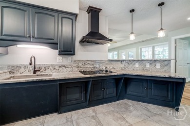 Welcome home to this stunning all-brick retreat featuring an