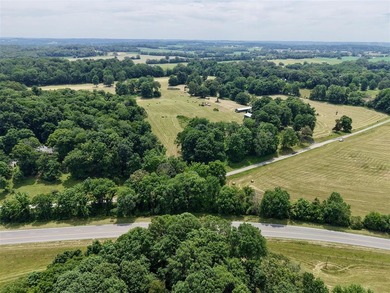 49+/- acres with a home, barns, road frontage, and room to grow - photo 14