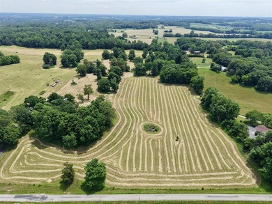 49+/- acres with a home, barns, road frontage, and room to grow - photo 16