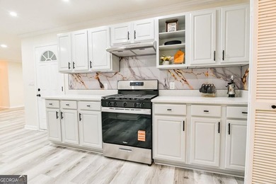 Beautifully renovated 3-bedroom, 2-bath brick ranch on nearly - photo 16