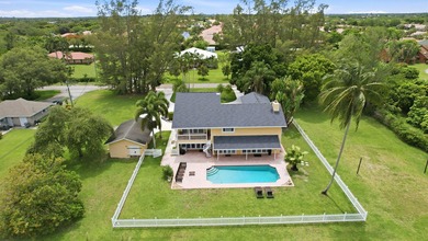 Is there a 4-bedroom home in Palm Beach County with acreage - photo 3
