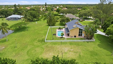 Is there a 4-bedroom home in Palm Beach County with acreage - photo 6