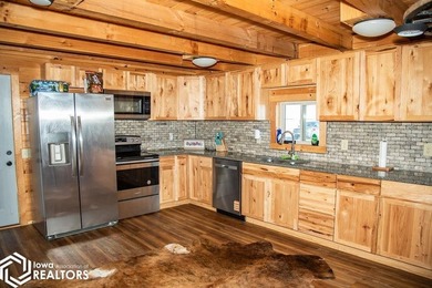 Rustic charm meets everyday convenience in this Amish-built log - photo 8