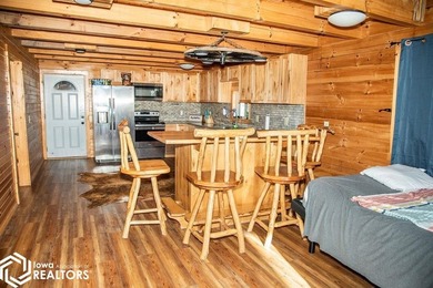 Rustic charm meets everyday convenience in this Amish-built log - photo 10