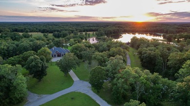 423+/- acre estate in Harrisburg, MO featuring a 27-acre stocked - photo 1