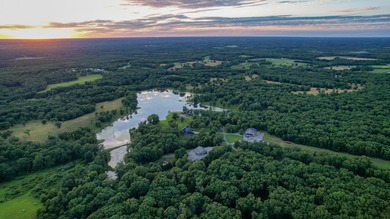 423+/- acre estate in Harrisburg, MO featuring a 27-acre stocked - photo 10