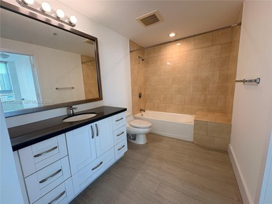 Bright corner unit at The Ivy Condominium featuring